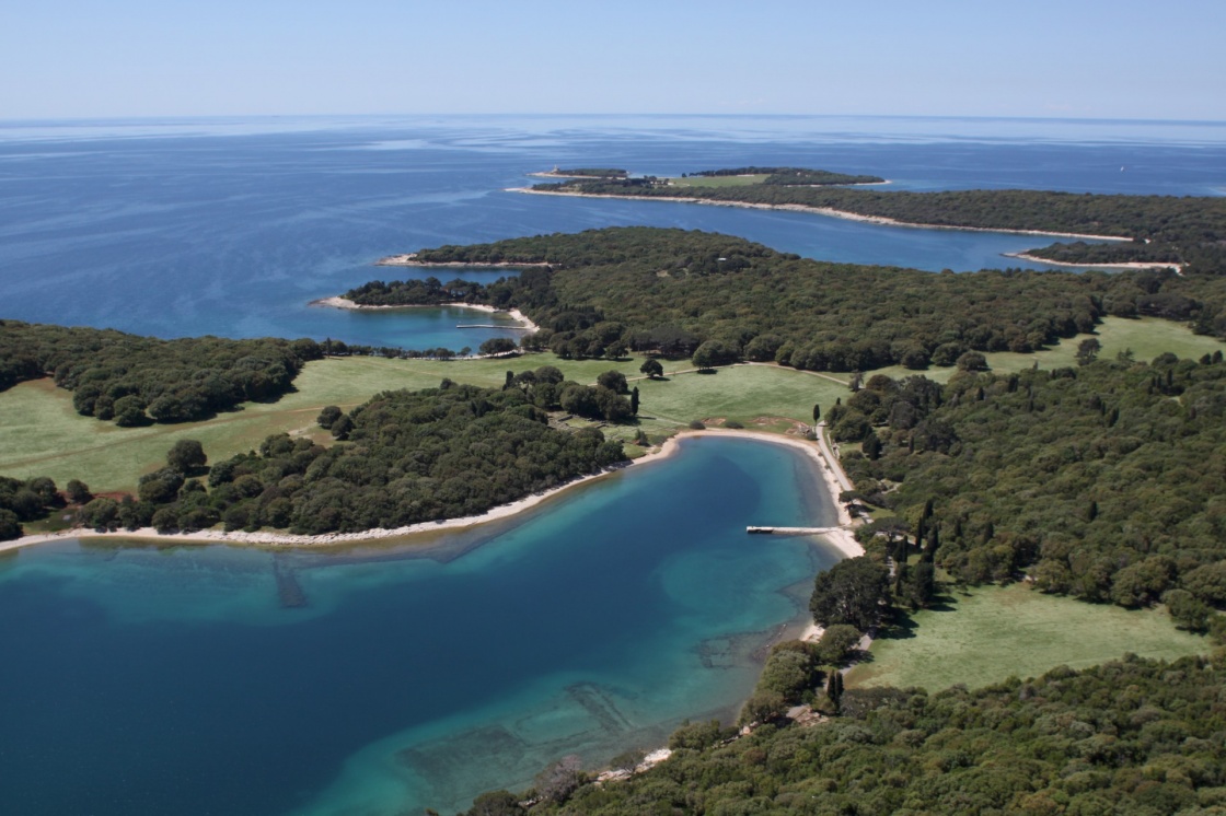 National park Brijuni  are a group of fourteen small islands in the Croatia part of the northern Adriatic Sea , bay Verige with old Roman monuments - aerial view